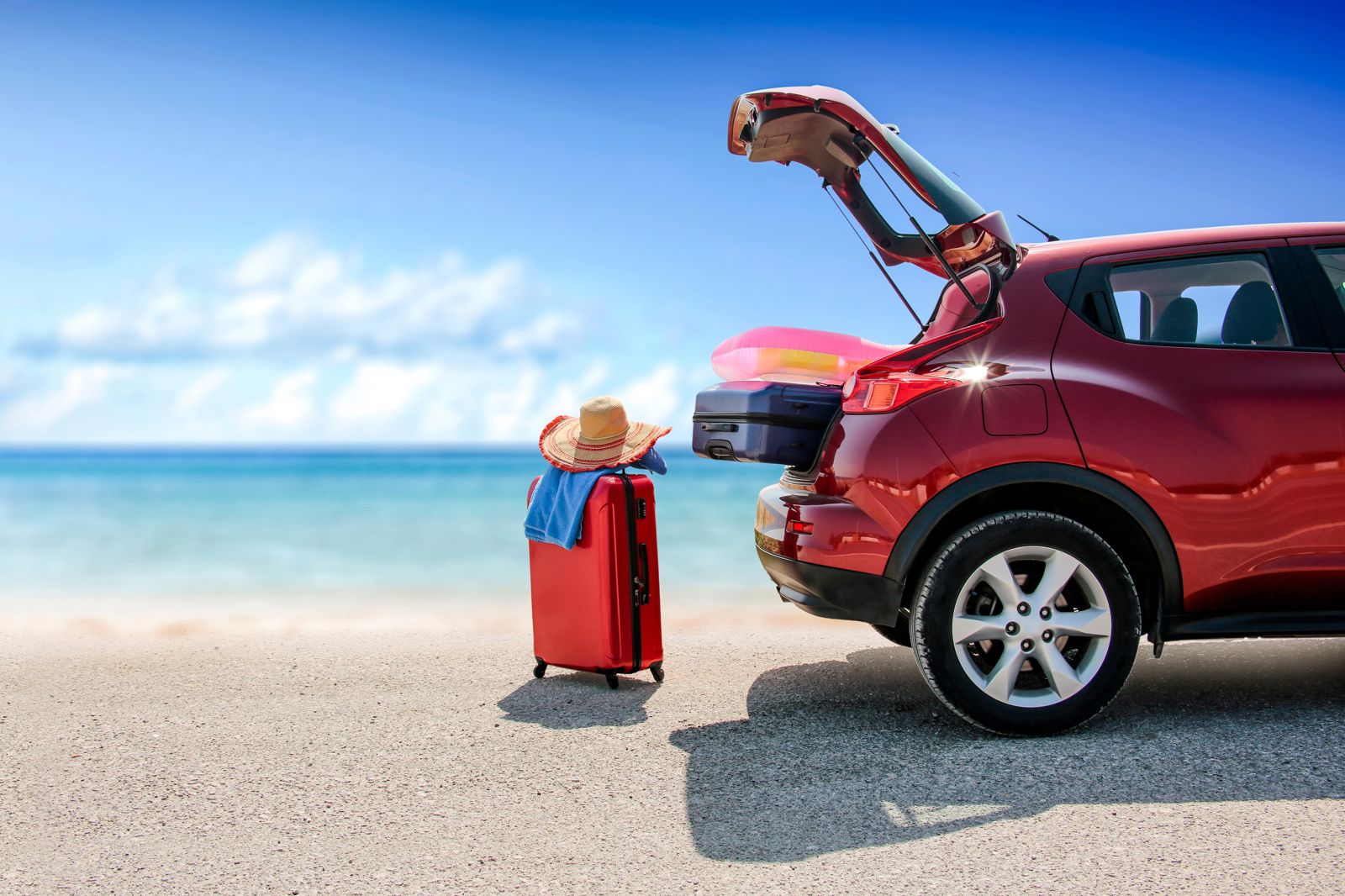 Summer,Time,And,Red,Car,On,Beach,With,Few,Suitcase