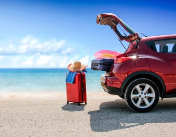 Summer,Time,And,Red,Car,On,Beach,With,Few,Suitcase.